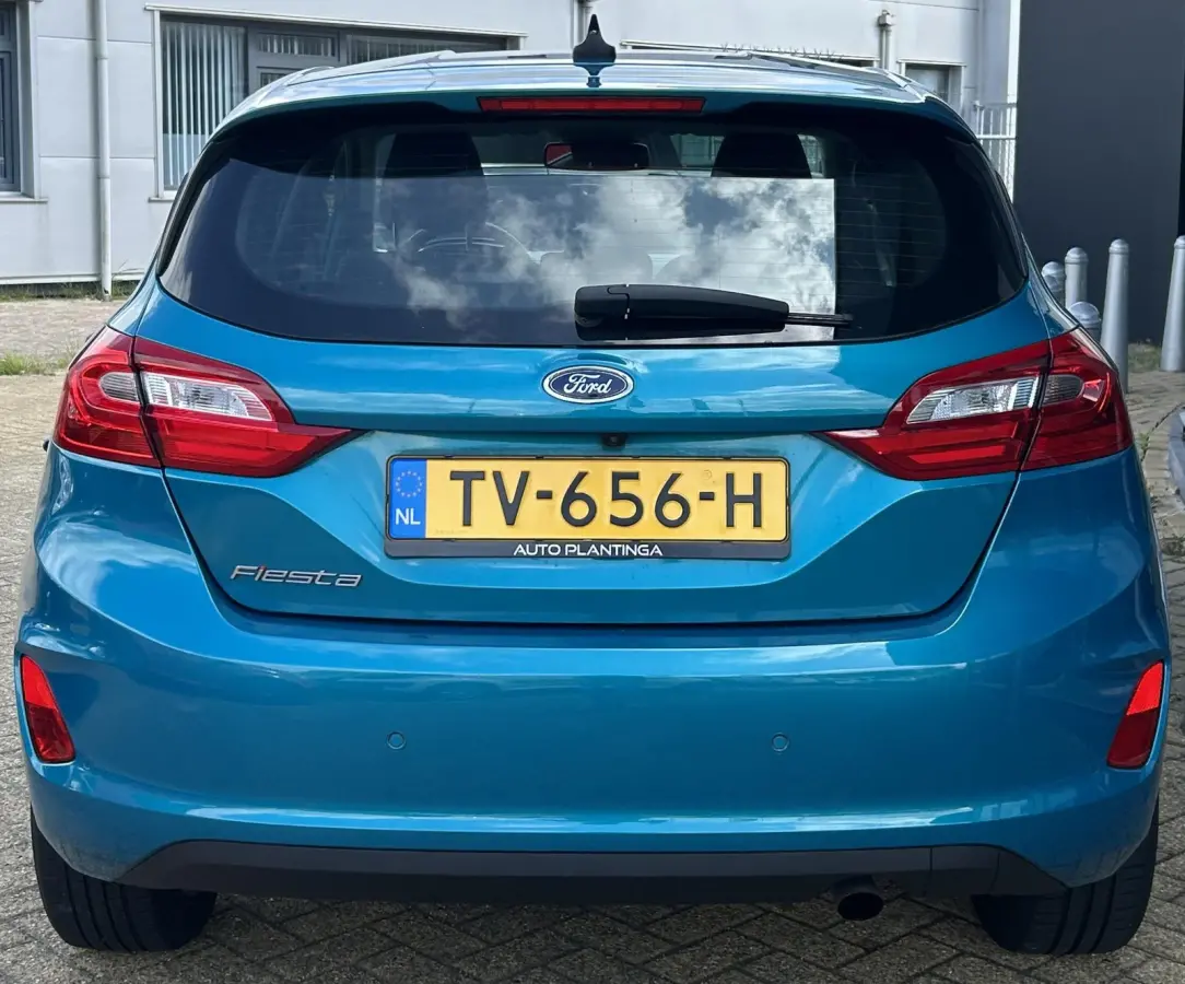 1.0 EcoBoost Titanium 101PK | LUXE | Achteruitrijcamera | B&O Audio | Climate Control | Navigatie | Adaptive Cruise Control | Voorruitverwarming | Parkeersensoren Voor en Achter | Lichtmetal