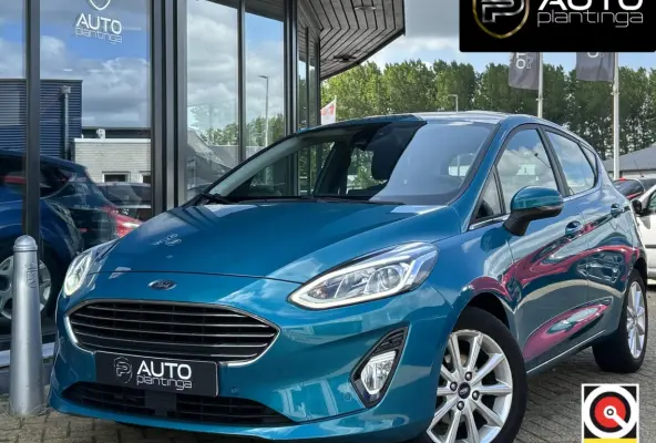 1.0 EcoBoost Titanium 101PK | LUXE | Achteruitrijcamera | B&O Audio | Climate Control | Navigatie | Adaptive Cruise Control | Voorruitverwarming | Parkeersensoren Voor en Achter | Lichtmetal