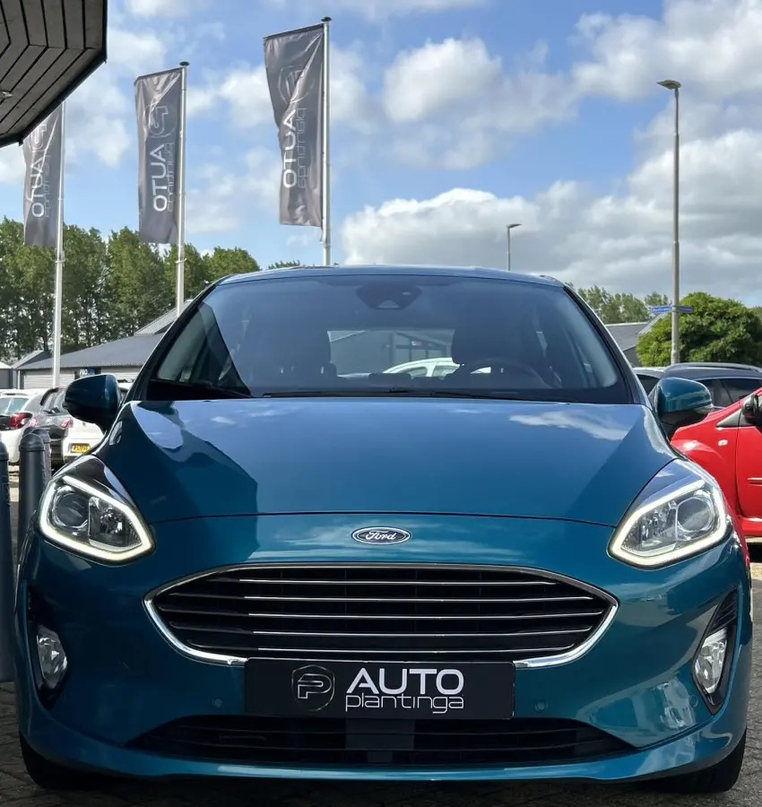 1.0 EcoBoost Titanium 101PK | LUXE | Achteruitrijcamera | B&O Audio | Climate Control | Navigatie | Adaptive Cruise Control | Voorruitverwarming | Parkeersensoren Voor en Achter | Lichtmetal