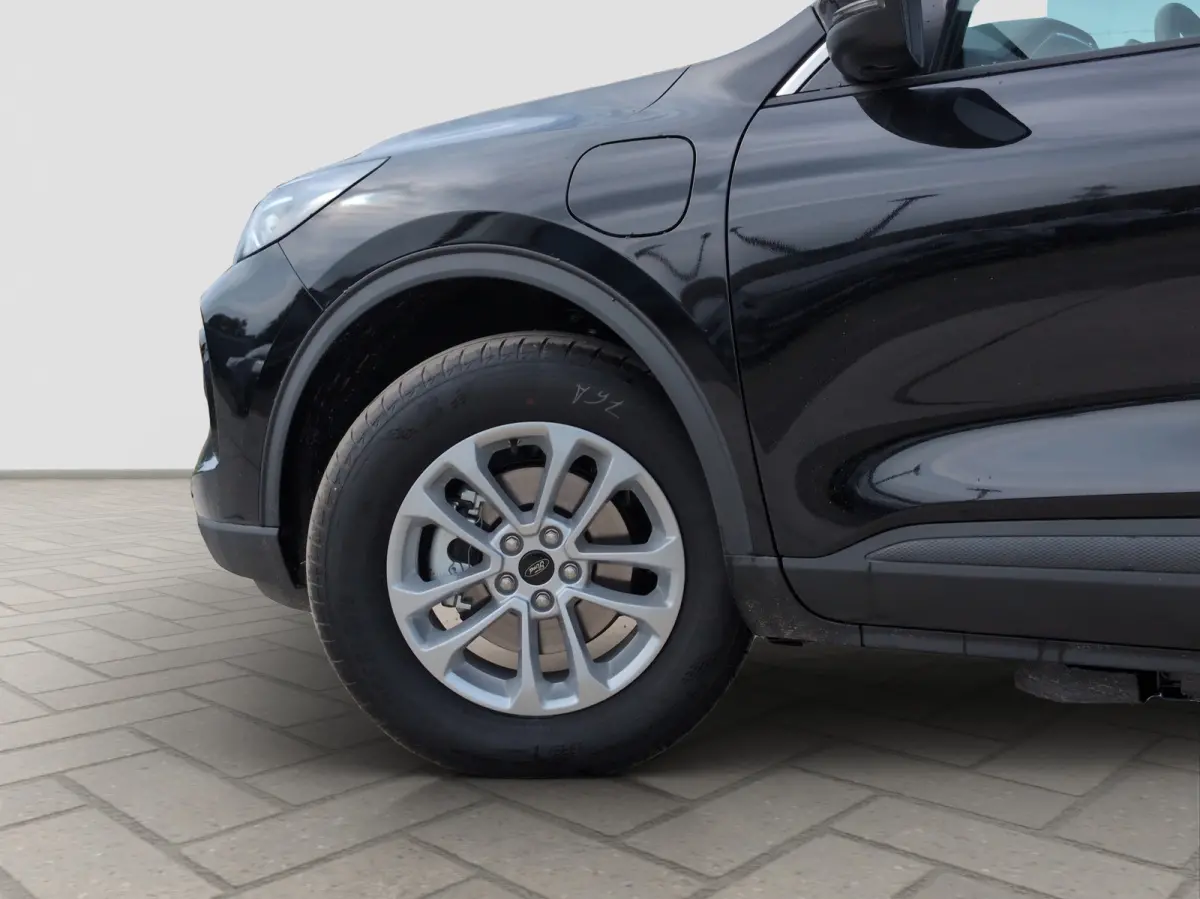Plug-In Hybrid Titanium | TREKHAAK | WINTERPAKKET | ADAPTIEVE CRUISE CONTROL | DRAADLOZE CARPLAY | Achteruitrijcamera | Adaptieve Cruise Control | Agate Black Metallic