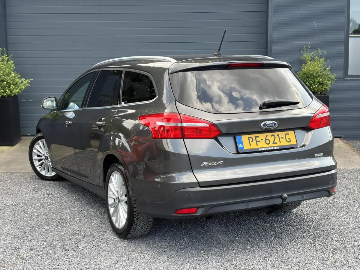 1.0 Titanium 2e Eigenaar,Navi,Trekhaak,125pk,Clima,Cruise,Pdc V+A,6 Bak,Lm velgen,N.A.P,Apk tot 07-2027