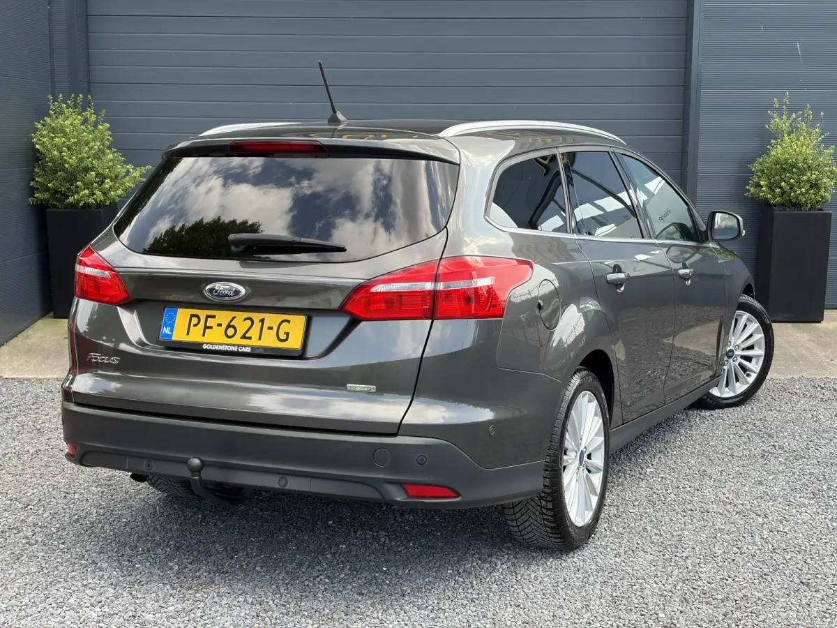 1.0 Titanium 2e Eigenaar,Navi,Trekhaak,125pk,Clima,Cruise,Pdc V+A,6 Bak,Lm velgen,N.A.P,Apk tot 07-2027
