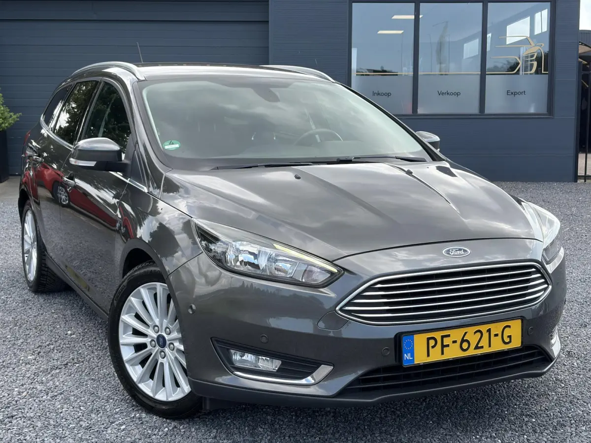 1.0 Titanium 2e Eigenaar,Navi,Trekhaak,125pk,Clima,Cruise,Pdc V+A,6 Bak,Lm velgen,N.A.P,Apk tot 07-2027