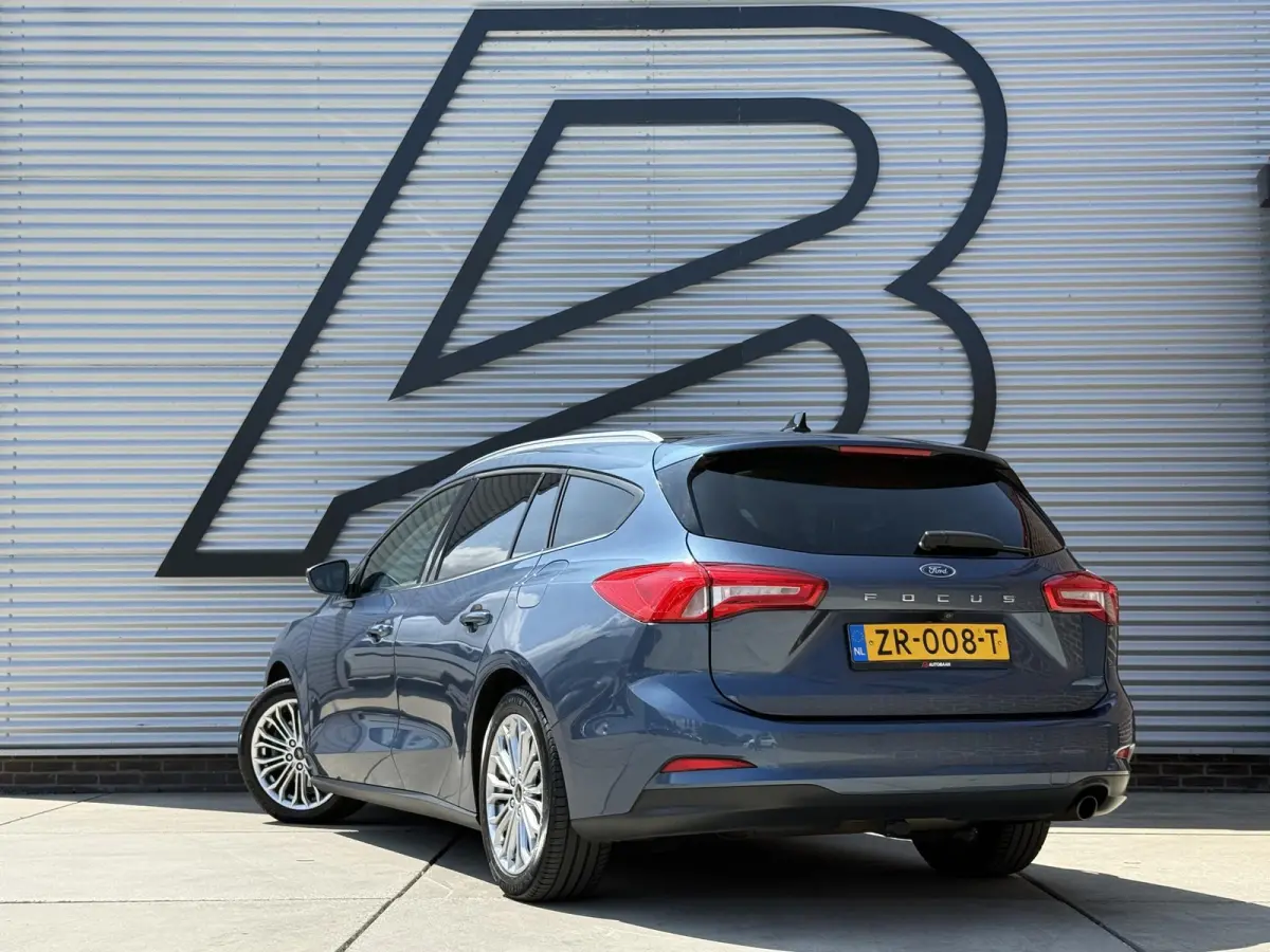 1.0 EcoBoost Titanium Business 2e Eigenaar|Pano|Stoel+stuurverw|Adap Cruise|Carplay|HUD|Dealer Onderhouden|Camera|Clima|PDC V+A|Trekhaak|LM velgen|Navi|Elek Ramen|N.A.P.|APK tot 07-2027