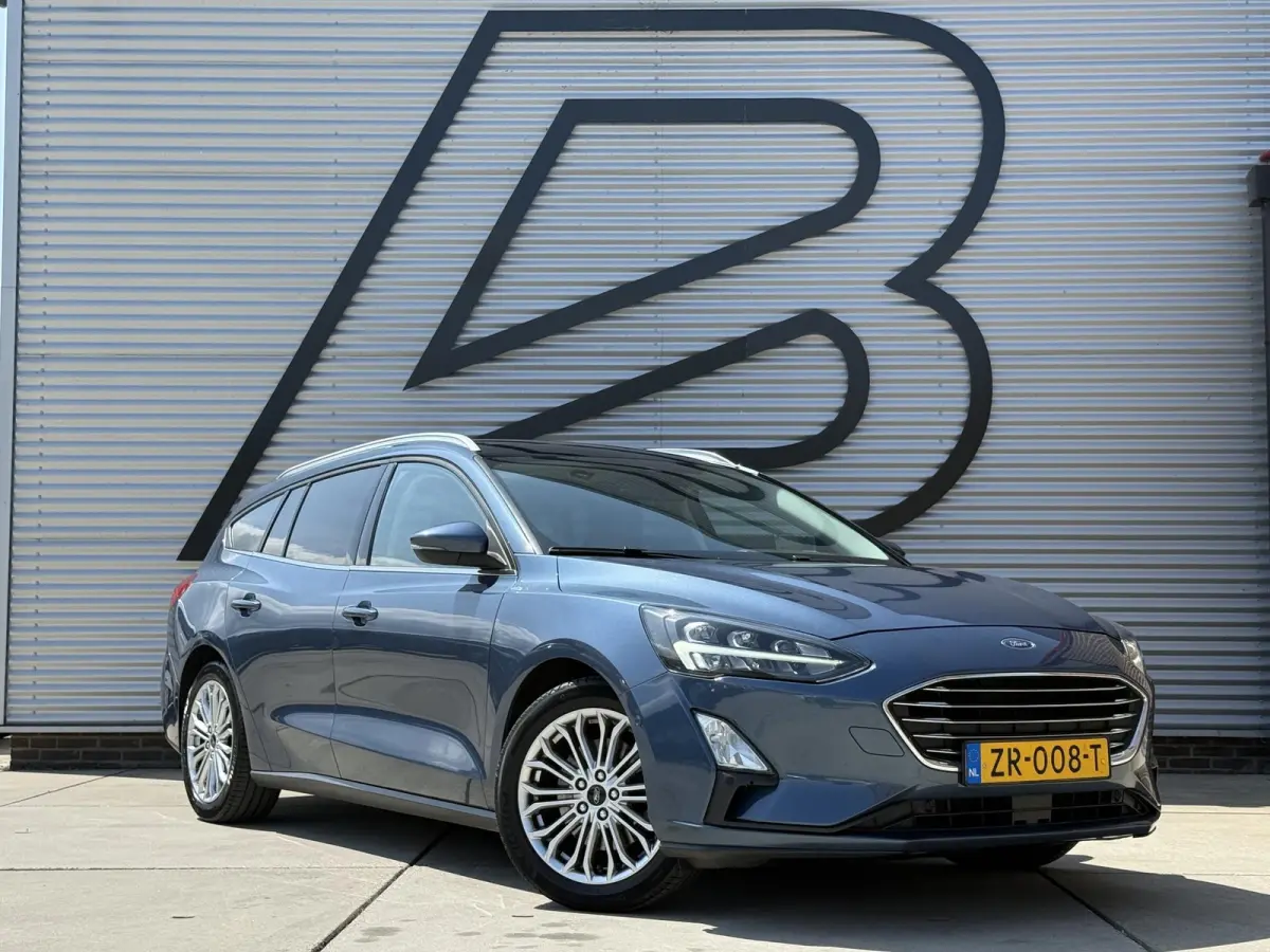 1.0 EcoBoost Titanium Business 2e Eigenaar|Pano|Stoel+stuurverw|Adap Cruise|Carplay|HUD|Dealer Onderhouden|Camera|Clima|PDC V+A|Trekhaak|LM velgen|Navi|Elek Ramen|N.A.P.|APK tot 07-2027