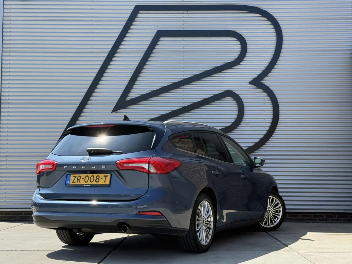 1.0 EcoBoost Titanium Business 2e Eigenaar|Pano|Stoel+stuurverw|Adap Cruise|Carplay|HUD|Dealer Onderhouden|Camera|Clima|PDC V+A|Trekhaak|LM velgen|Navi|Elek Ramen|N.A.P.|APK tot 07-2027