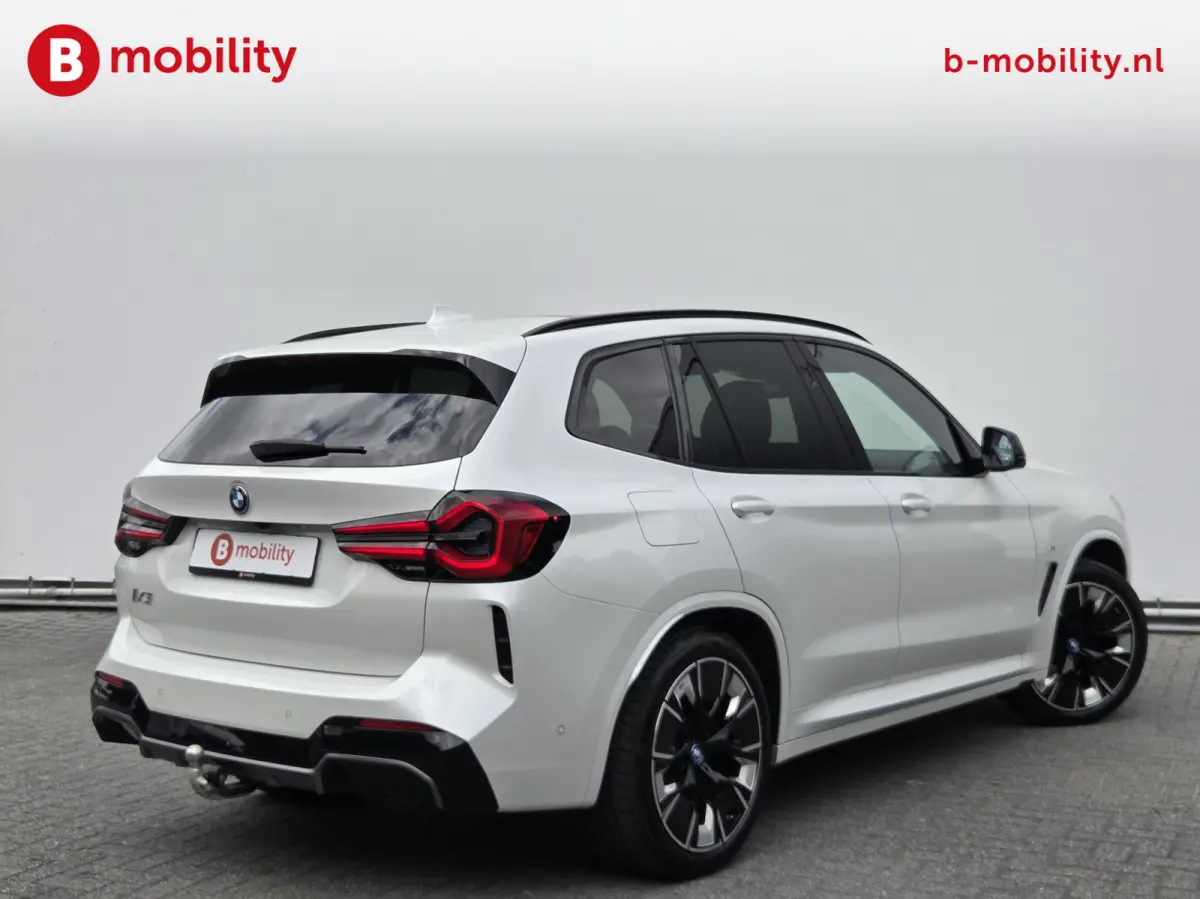 High Executive 80 kWh M-Sport 'Mineral-Weiss' Trekhaak Panoramadak | Head-Up | Harman/Kardon | Adaptive LED | ACC | DAB