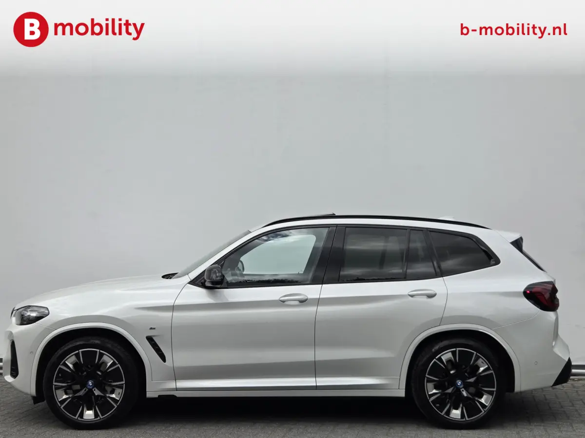 High Executive 80 kWh M-Sport 'Mineral-Weiss' Trekhaak Panoramadak | Head-Up | Harman/Kardon | Adaptive LED | ACC | DAB