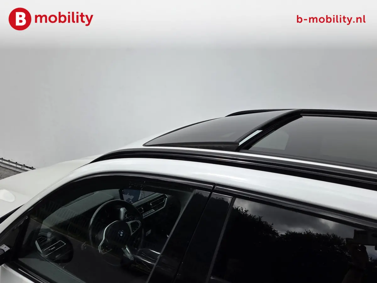 High Executive 80 kWh M-Sport 'Mineral-Weiss' Trekhaak Panoramadak | Head-Up | Harman/Kardon | Adaptive LED | ACC | DAB