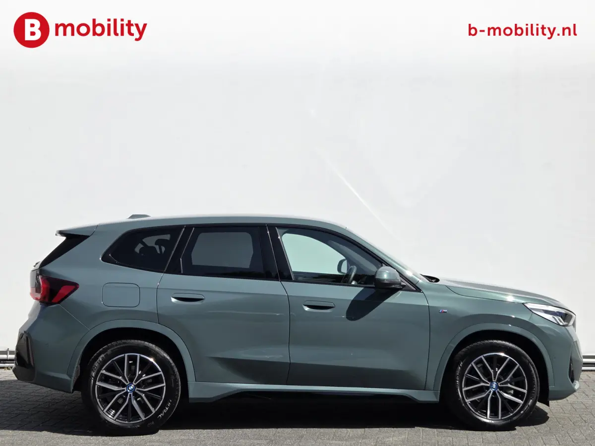 eDrive20 67 kWh M-Sport SOH 99% Driving Assist. Plus | Sportstoelen | Park Assist | Leer | Adaptive Cruise Control | DAB | NL Auto! | Achteruitrijcamera
