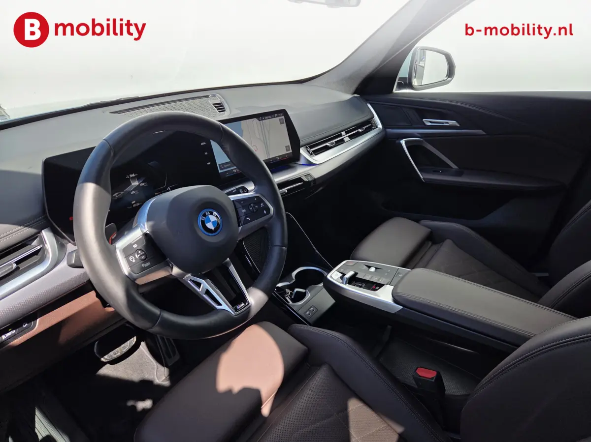 eDrive20 67 kWh M-Sport SOH 99% Driving Assist. Plus | Sportstoelen | Park Assist | Leer | Adaptive Cruise Control | DAB | NL Auto! | Achteruitrijcamera