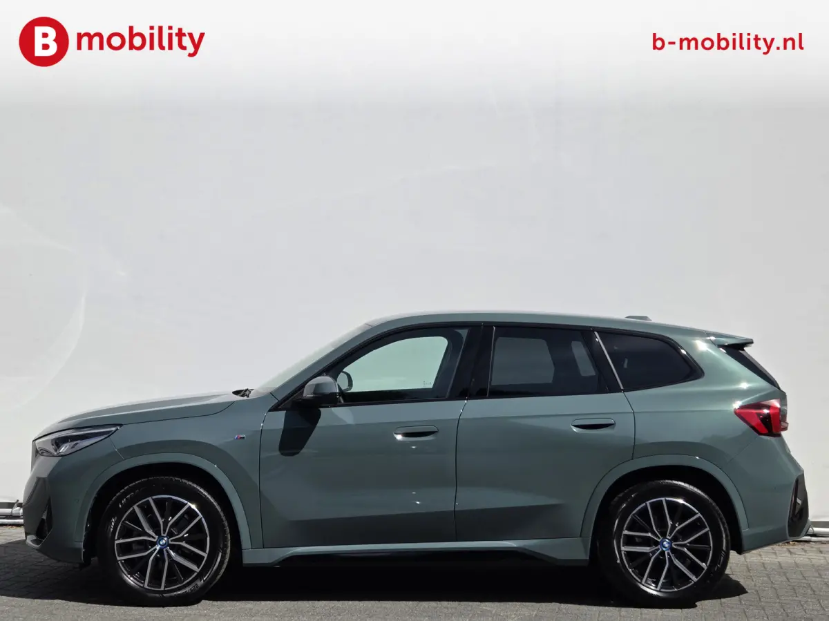 eDrive20 67 kWh M-Sport SOH 99% Driving Assist. Plus | Sportstoelen | Park Assist | Leer | Adaptive Cruise Control | DAB | NL Auto! | Achteruitrijcamera