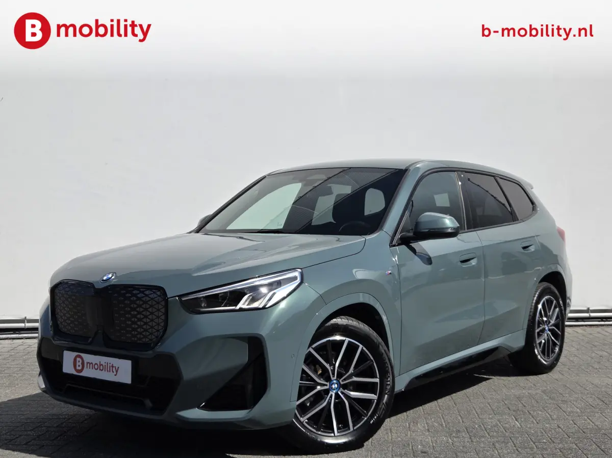 eDrive20 67 kWh M-Sport SOH 99% Driving Assist. Plus | Sportstoelen | Park Assist | Leer | Adaptive Cruise Control | DAB | NL Auto! | Achteruitrijcamera