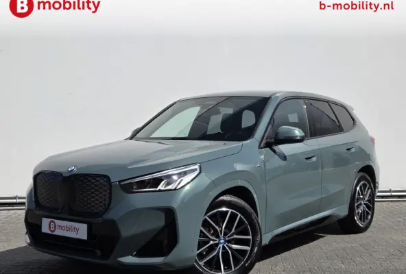 eDrive20 67 kWh M-Sport SOH 99% Driving Assist. Plus | Sportstoelen | Park Assist | Leer | Adaptive Cruise Control | DAB | NL Auto! | Achteruitrijcamera