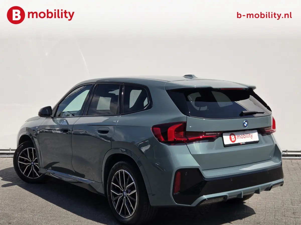 eDrive20 67 kWh M-Sport SOH 99% Driving Assist. Plus | Sportstoelen | Park Assist | Leer | Adaptive Cruise Control | DAB | NL Auto! | Achteruitrijcamera