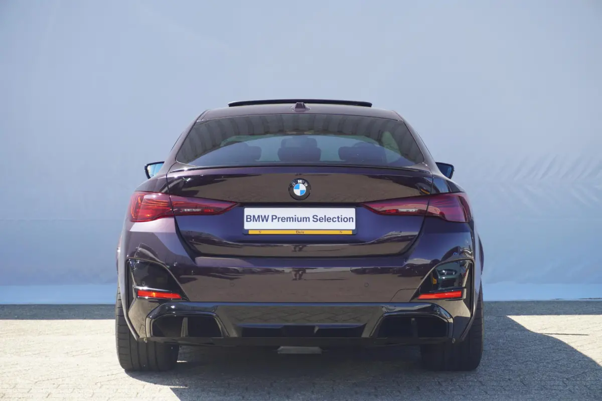 eDrive40 M Sport Pro | Schuif-/kanteldak | M Sportstoelen | Active Cruise Control | Harman Kardon | Elektrische stoelen met geheugen