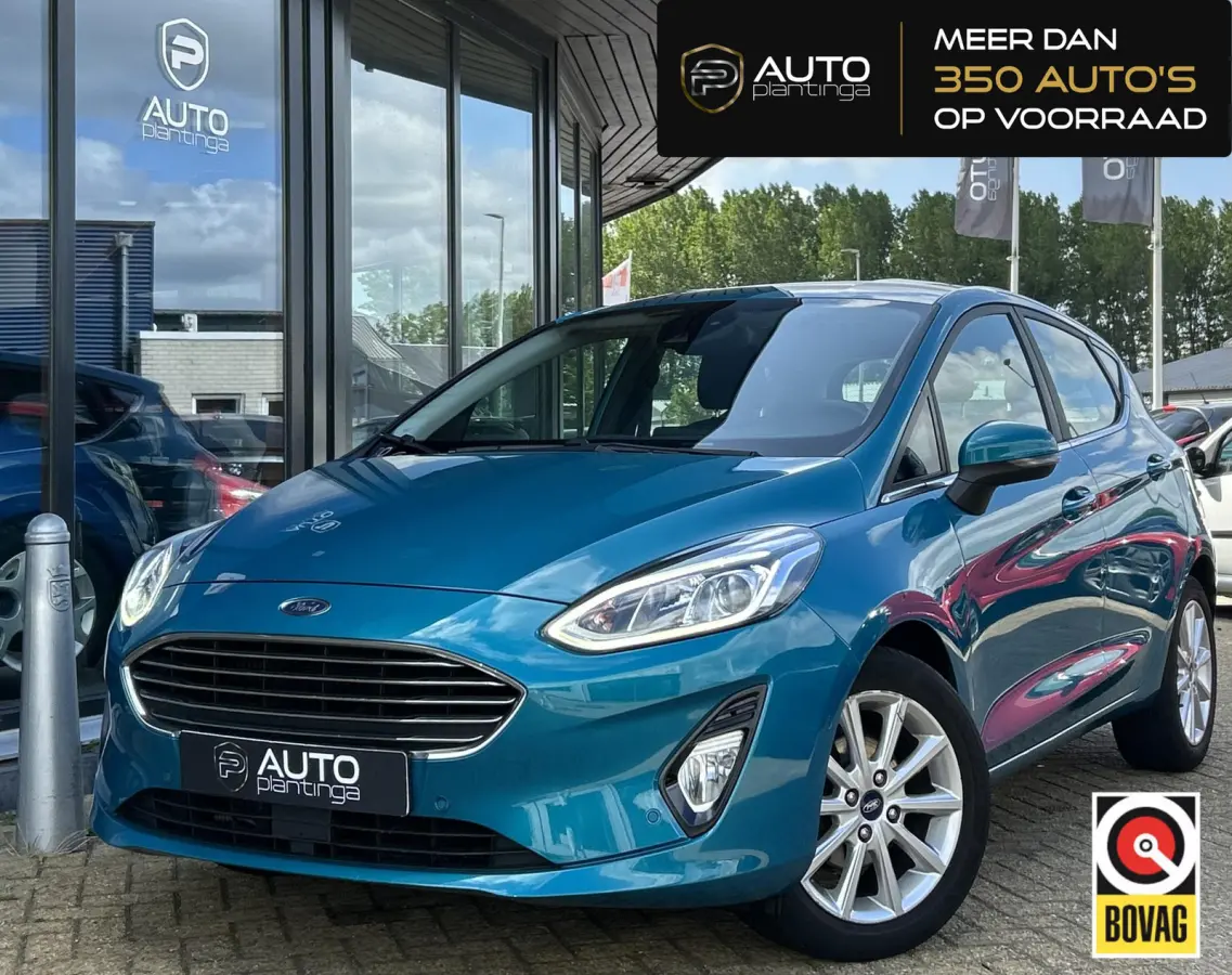 1.0 EcoBoost Titanium 101PK | LUXE | Achteruitrijcamera | B&O Audio | Climate Control | Navigatie | Adaptive Cruise Control | Voorruitverwarming | Parkeersensoren Voor en Achter | Lichtmetal