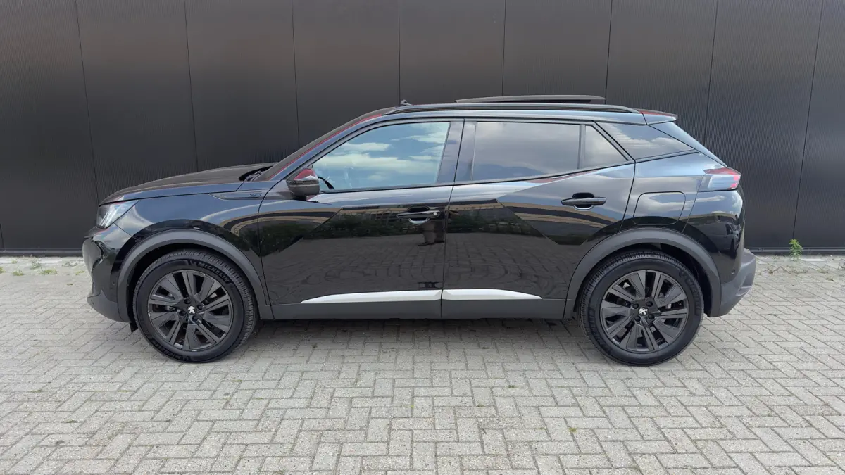EV GT Pack 50 kWh | Panorama Dak | Stoelverwarming Voor | Adaptieve Cruise Control | Achteruitrijd Camera | Adaptieve Lane Assist | Keyless Entry | Achteruitrijcamera | Cruise control adapti