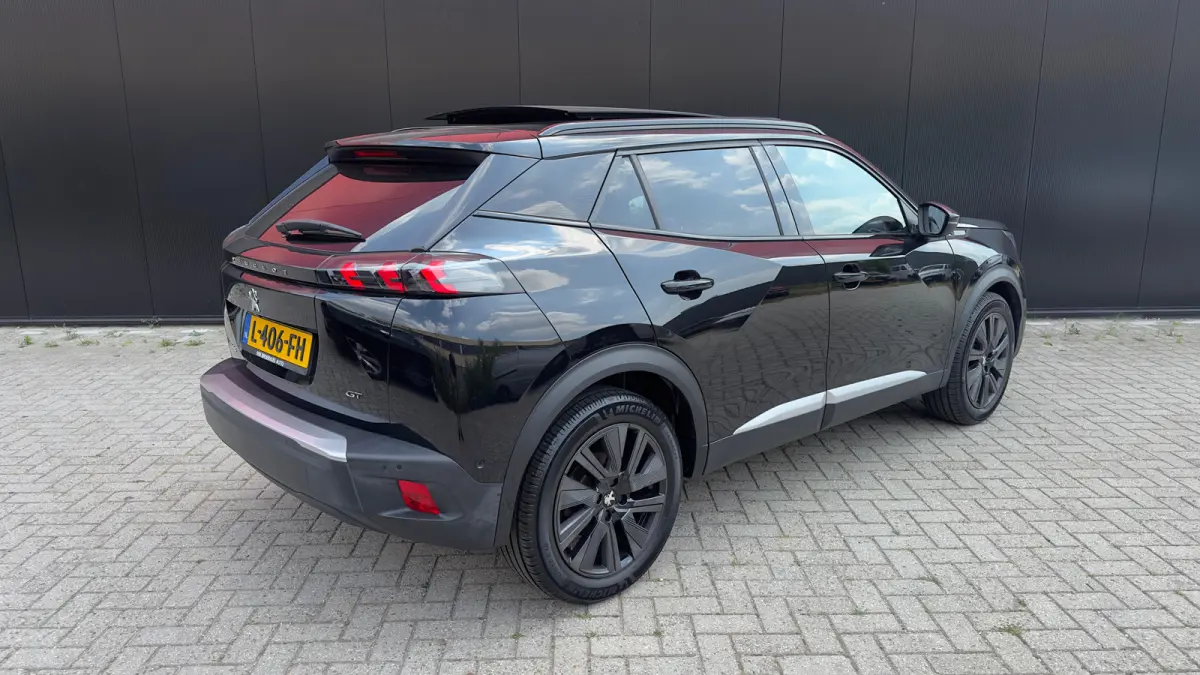 EV GT Pack 50 kWh | Panorama Dak | Stoelverwarming Voor | Adaptieve Cruise Control | Achteruitrijd Camera | Adaptieve Lane Assist | Keyless Entry | Achteruitrijcamera | Cruise control adapti