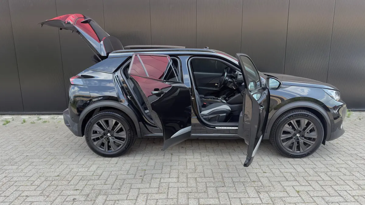 EV GT Pack 50 kWh | Panorama Dak | Stoelverwarming Voor | Adaptieve Cruise Control | Achteruitrijd Camera | Adaptieve Lane Assist | Keyless Entry | Achteruitrijcamera | Cruise control adapti