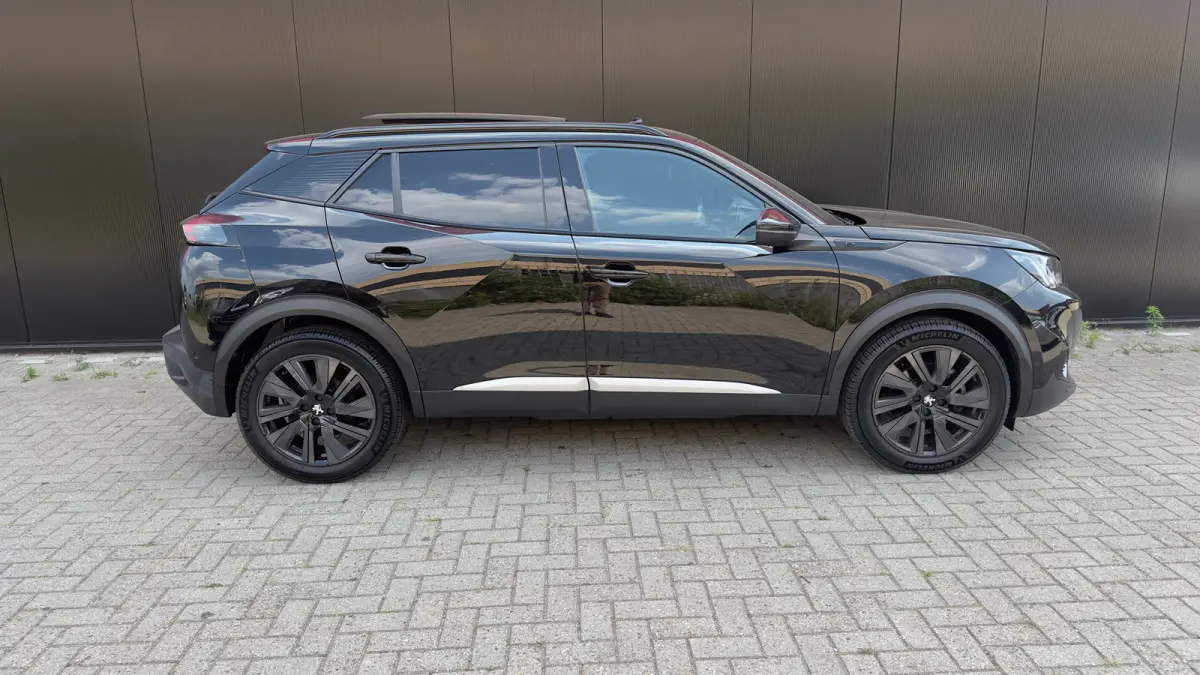 EV GT Pack 50 kWh | Panorama Dak | Stoelverwarming Voor | Adaptieve Cruise Control | Achteruitrijd Camera | Adaptieve Lane Assist | Keyless Entry | Achteruitrijcamera | Cruise control adapti
