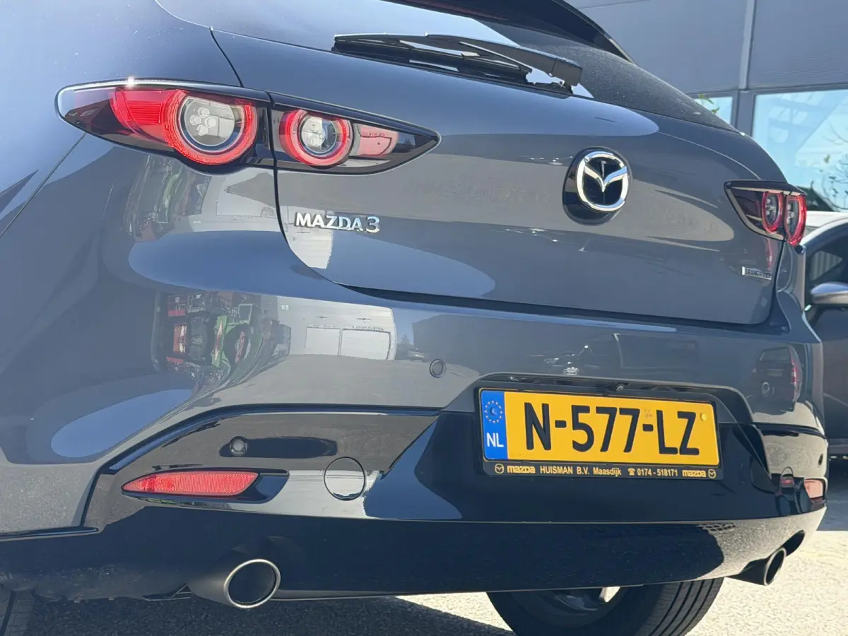2.0 e-SkyActiv-G M Hybrid 122 Comfort met Bose | Apple Carplay / Android Auto | Navigatiesysteem | Licht + Regensensor | Elektrisch Verstelbare Bestuurderstoel  | Stoel + Stuurverwarming | P