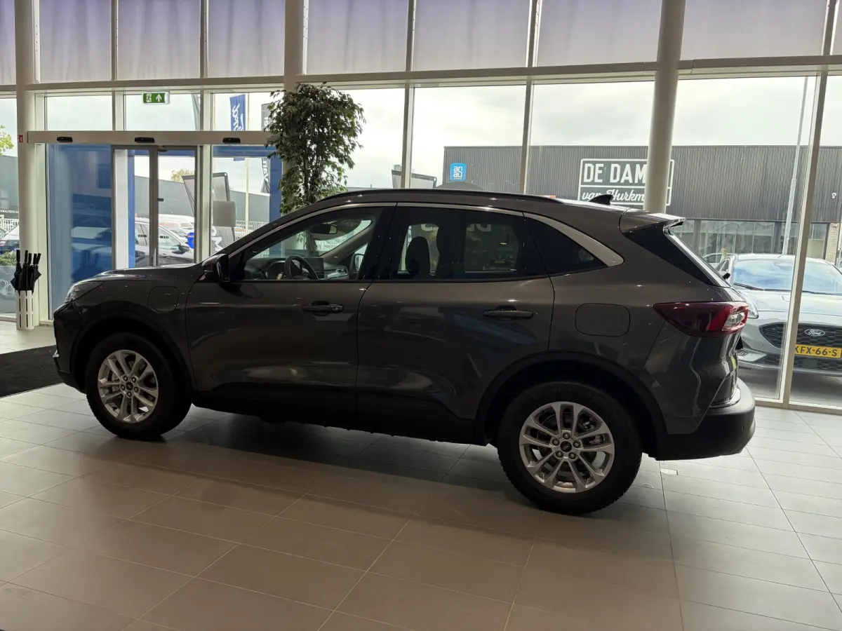 2.5 PHEV Titanium | WEGKLAPBARE TREKHAAK | VERWARMBARE VOORSTOELEN | VERWARMBAAR STUURWIEL | VERWARMBARE VOORRUIT | KEYLESS ENTRY | APPLE CAR PLAY | PARKEERSENSOREN | ACHTERUITRIJCAMERA | NA