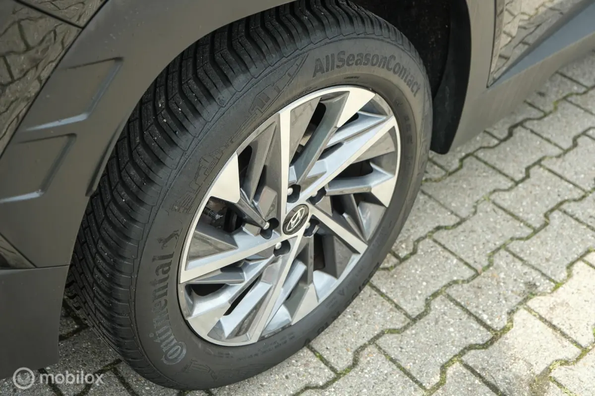 1.6 T-GDI MHEV Comfort Smart | Pano | Stoelverwarming | Trekhaak | 18 Inch | Carplay | LED | Camera | All seasons