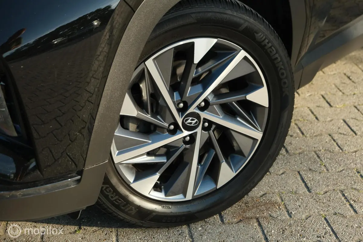 1.6 T-GDI MHEV Comfort Smart | Pano | Stoelverwarming | Trekhaak | 18 Inch | Carplay | LED | Camera | All seasons