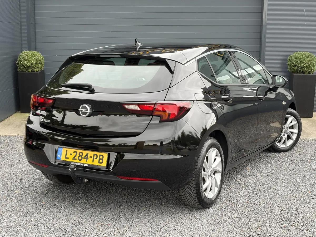 1.2 Business Elegance 2e Eigenaar l Navi l Camera l Carplay l Keyless l Trekhaak l 110pk l Pdc V+A l Halfleder l 6 Bak l N.A.P l | Lm velgen l Rijstrooksensor l Apk tot 07-2027