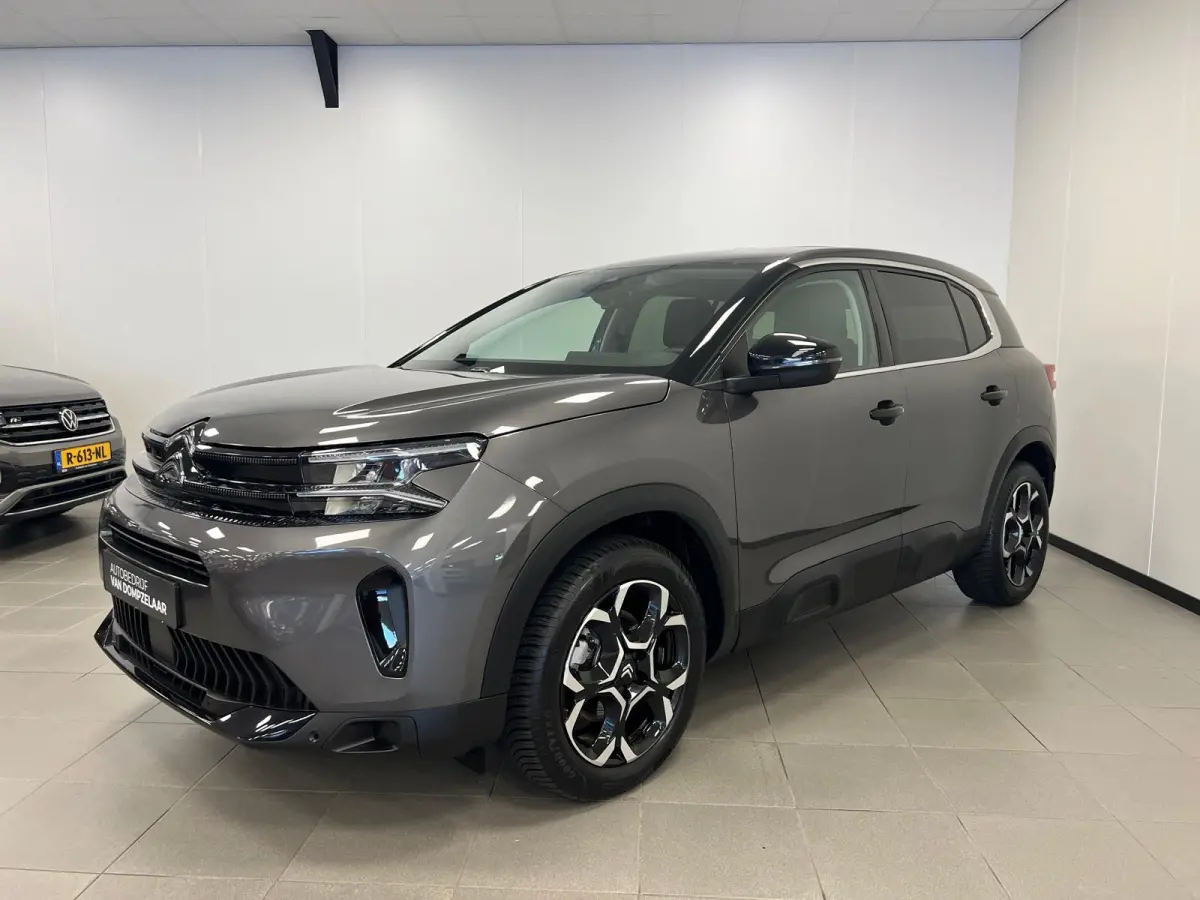 1.2 HYBRID 145PK AUTOMAAT PLUS UITV. / NAVI / STOEL-VERW. / KEYLESS / CAMERA / CRUISE.C /