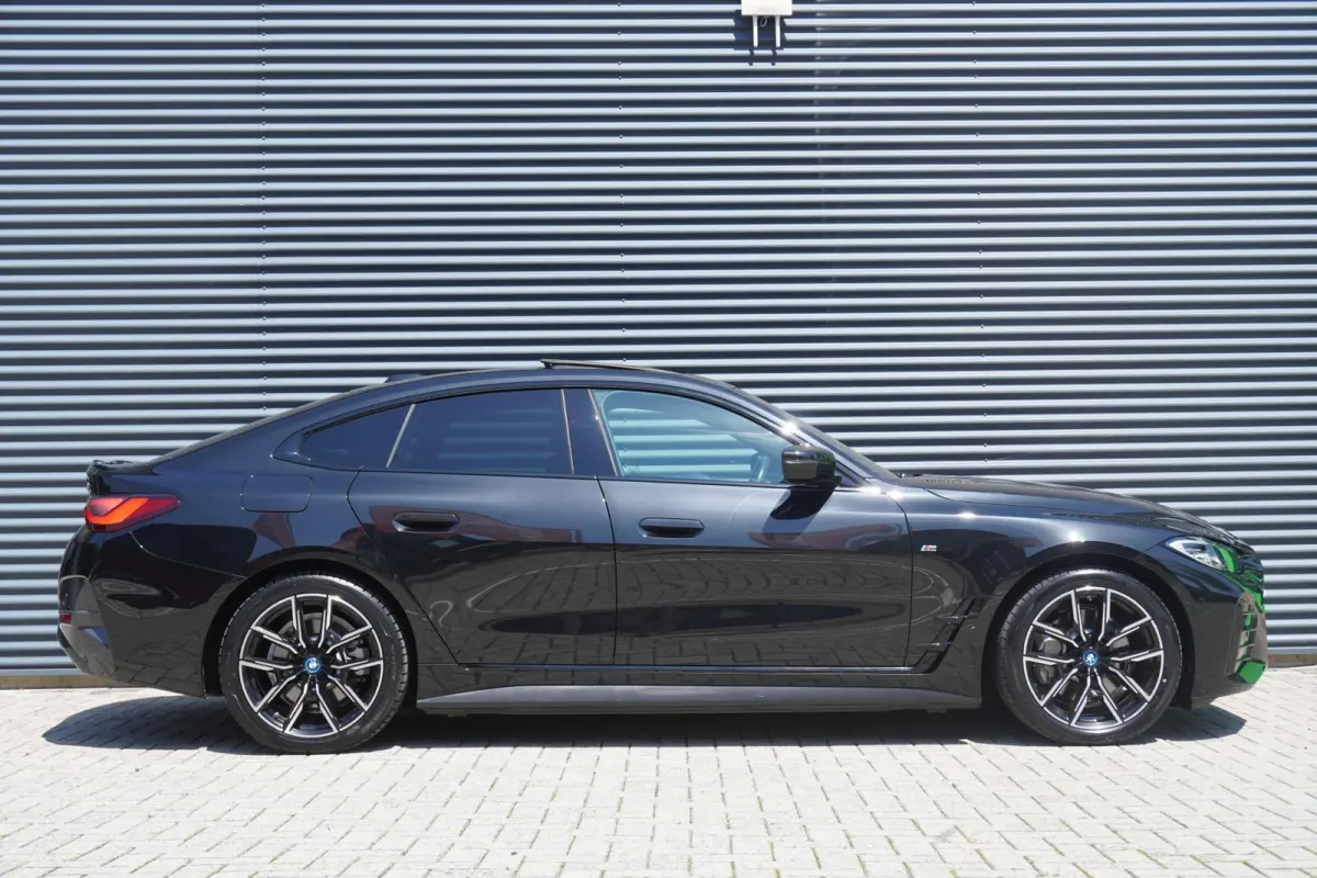 eDrive40 340pk High Executive 84 kWh | SoH 94% | M-Sport | Panoramadak | Adaptive Cruise | Stoelverwarming | Apple CarPlay