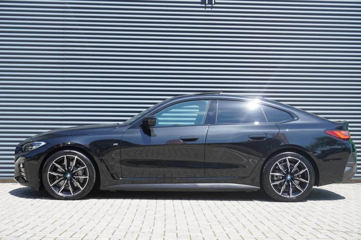 eDrive40 340pk High Executive 84 kWh | SoH 94% | M-Sport | Panoramadak | Adaptive Cruise | Stoelverwarming | Apple CarPlay