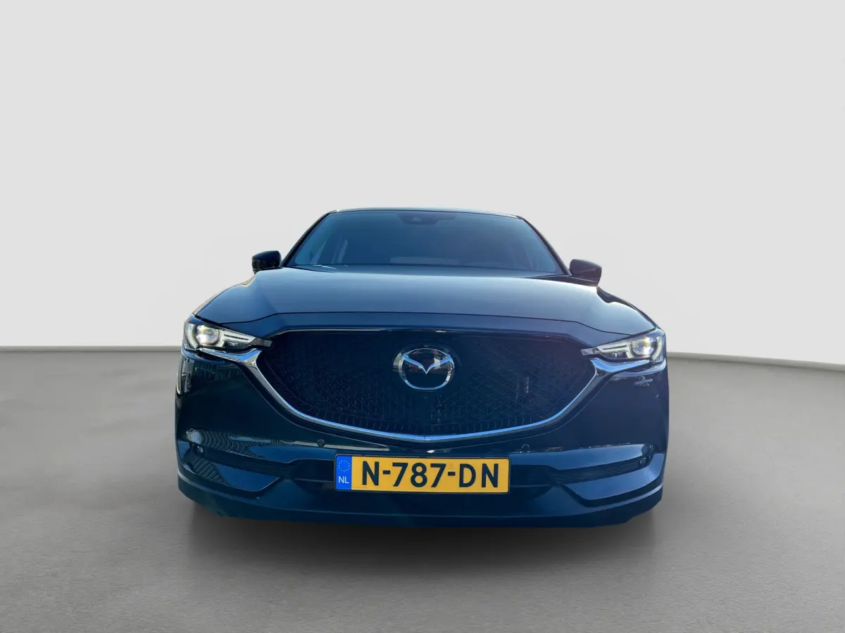 2.0 SkyActiv-G 165 Newground Automaat | 360 graden camera | Adaptive cruise control | Elektrische achterklep | Bestuurdersstoel met geheugen | Half leder | Stoelverwarming | Dodehoek detecti