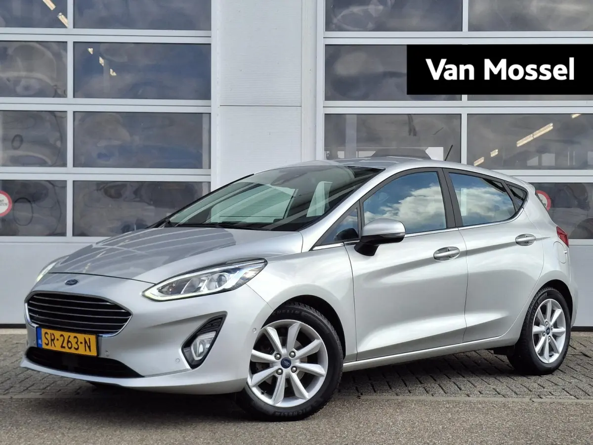 1.0 EcoBoost Titanium | Trekhaak | Adaptieve Cruise Control | 16'' LMV | Voorruitverwarming | Achteruitcamera | Climate Control | B&O Premium Sound | Parkeersensoren V+A |