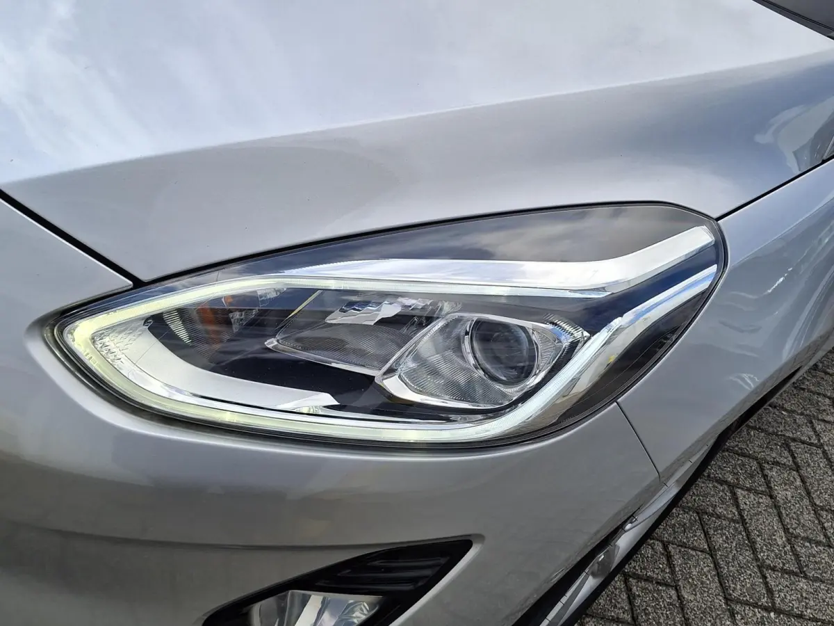 1.0 EcoBoost Titanium | Trekhaak | Adaptieve Cruise Control | 16'' LMV | Voorruitverwarming | Achteruitcamera | Climate Control | B&O Premium Sound | Parkeersensoren V+A |