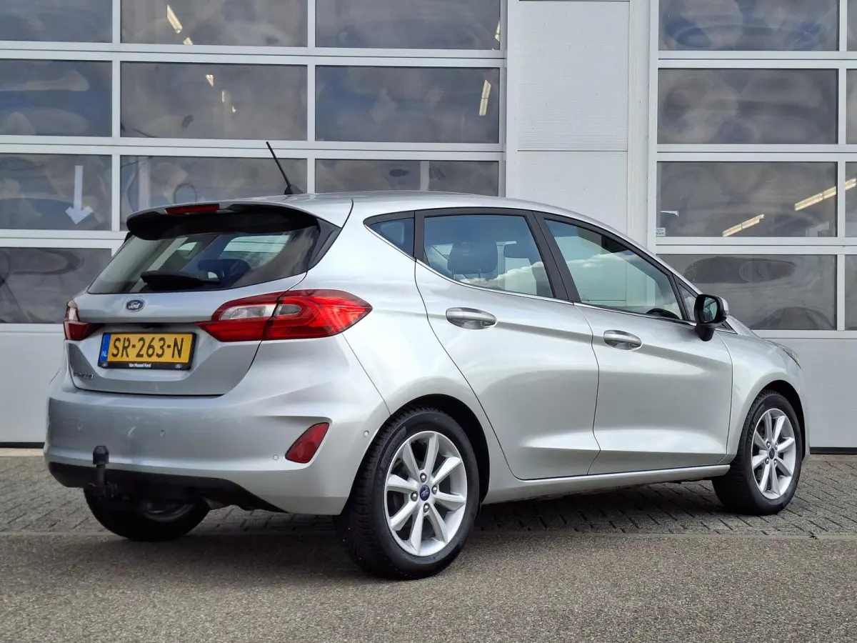 1.0 EcoBoost Titanium | Trekhaak | Adaptieve Cruise Control | 16'' LMV | Voorruitverwarming | Achteruitcamera | Climate Control | B&O Premium Sound | Parkeersensoren V+A |