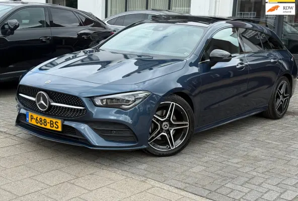 180 Business Solution AMG,NL-auto,Panoramadak,Ambient,Stoelverwarming,Navigatie