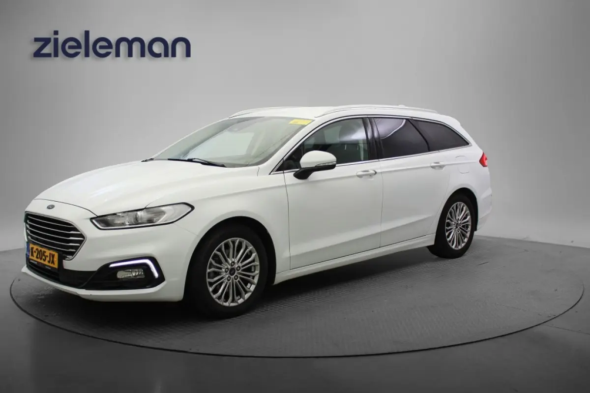 2.0 IVCT HEV Titanium - Carplay, Cruise, Clima, Stoelverw.