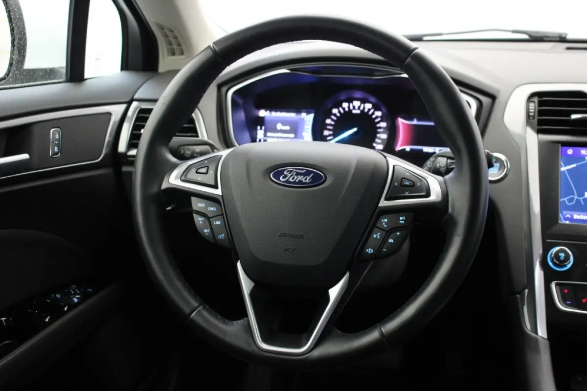 2.0 IVCT HEV Titanium - Carplay, Cruise, Clima, Stoelverw.