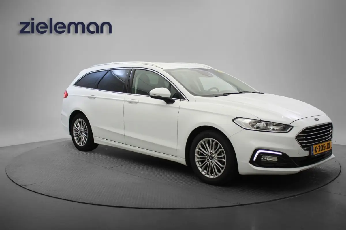 2.0 IVCT HEV Titanium - Carplay, Cruise, Clima, Stoelverw.