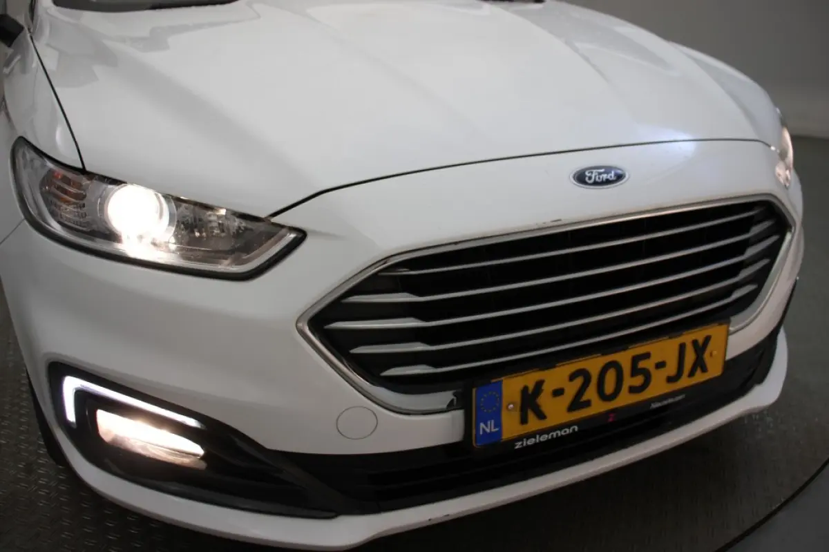 2.0 IVCT HEV Titanium - Carplay, Cruise, Clima, Stoelverw.