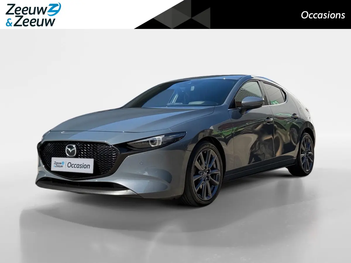 2.0 e-SkyActiv-G M Hybrid 122 Comfort met Bose | Apple Carplay / Android Auto | Navigatiesysteem | Licht + Regensensor | Elektrisch Verstelbare Bestuurderstoel  | Stoel + Stuurverwarming | P