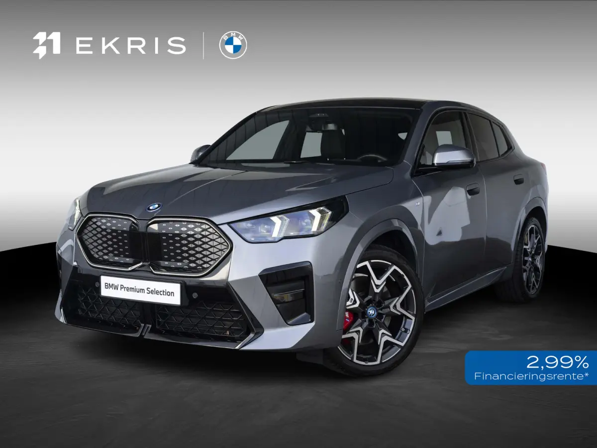 eDrive20 SoH 100% | M Sportpakket Pro | Innovation Pack | 20 inch | Stuurwielrand verwarmd | M Adaptief onderstel | Iconic Glow nierengrille | Glazen Panoramadak | Trekhaak