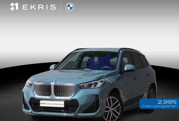 eDrive20 | M Sportpakket | Getinte ramen | 18 inch LM-Velgen | Achteruitrijcamera | Actiefstoelen voor | Elektrisch verwarmde voorstoelen