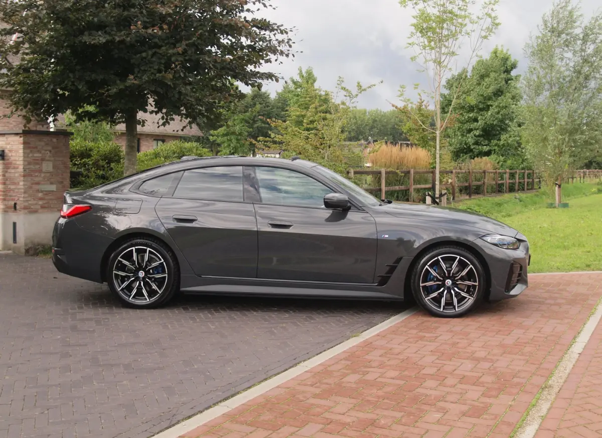eDrive40 High Executive 84 kWh | SOH 98% | M-Pakket | Schuifdak | Sfeerverlichting | Led-Laser | Harman Kardon | Camera |