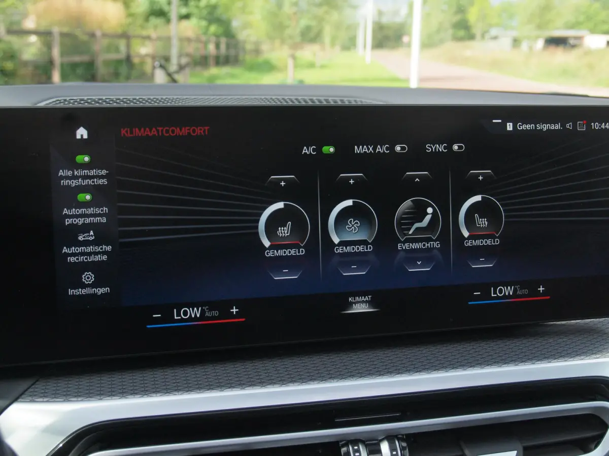 eDrive40 High Executive 84 kWh | SOH 98% | M-Pakket | Schuifdak | Sfeerverlichting | Led-Laser | Harman Kardon | Camera |