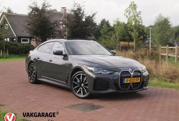 eDrive40 High Executive 84 kWh | SOH 98% | M-Pakket | Schuifdak | Sfeerverlichting | Led-Laser | Harman Kardon | Camera |