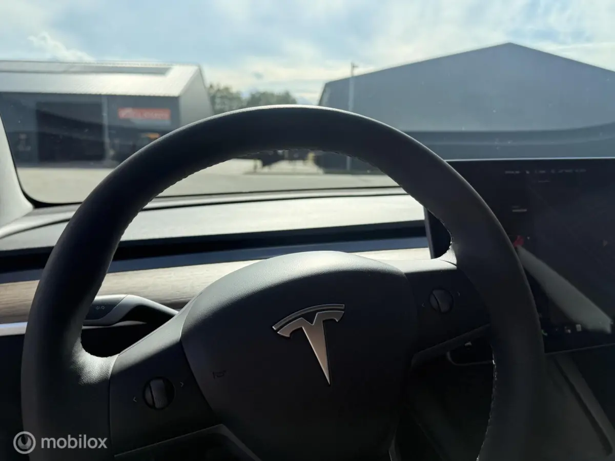 Long Range AWD 75 kWh | Warmtepomp | 88,9% SOH | Rood Mica