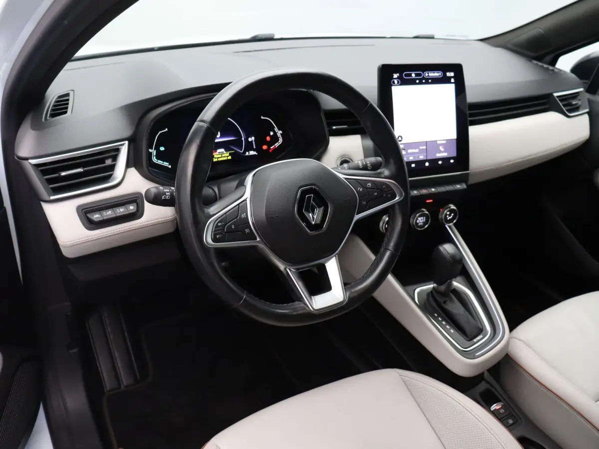 E-Tech Hybrid 140pk Initiale Paris | Stoel- en stuurwielverwarming | Lederen bekleding | Achteruitrijcamera | Apple Carplay / Android Auto |